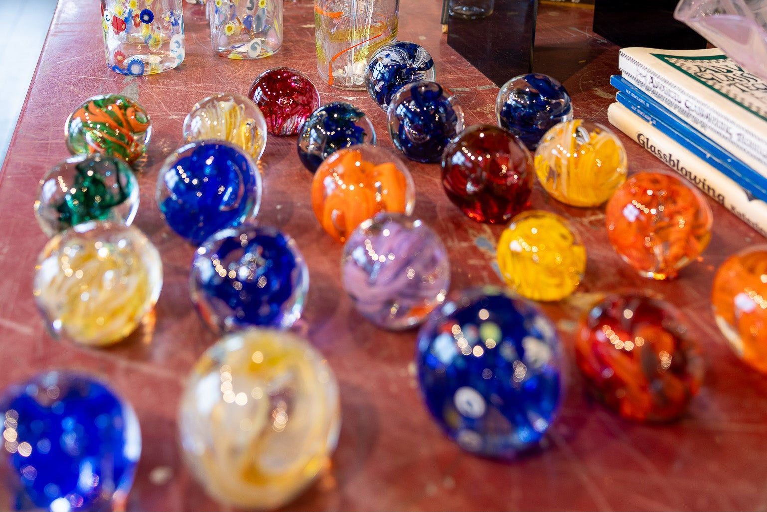 an assortment of glass paperweights