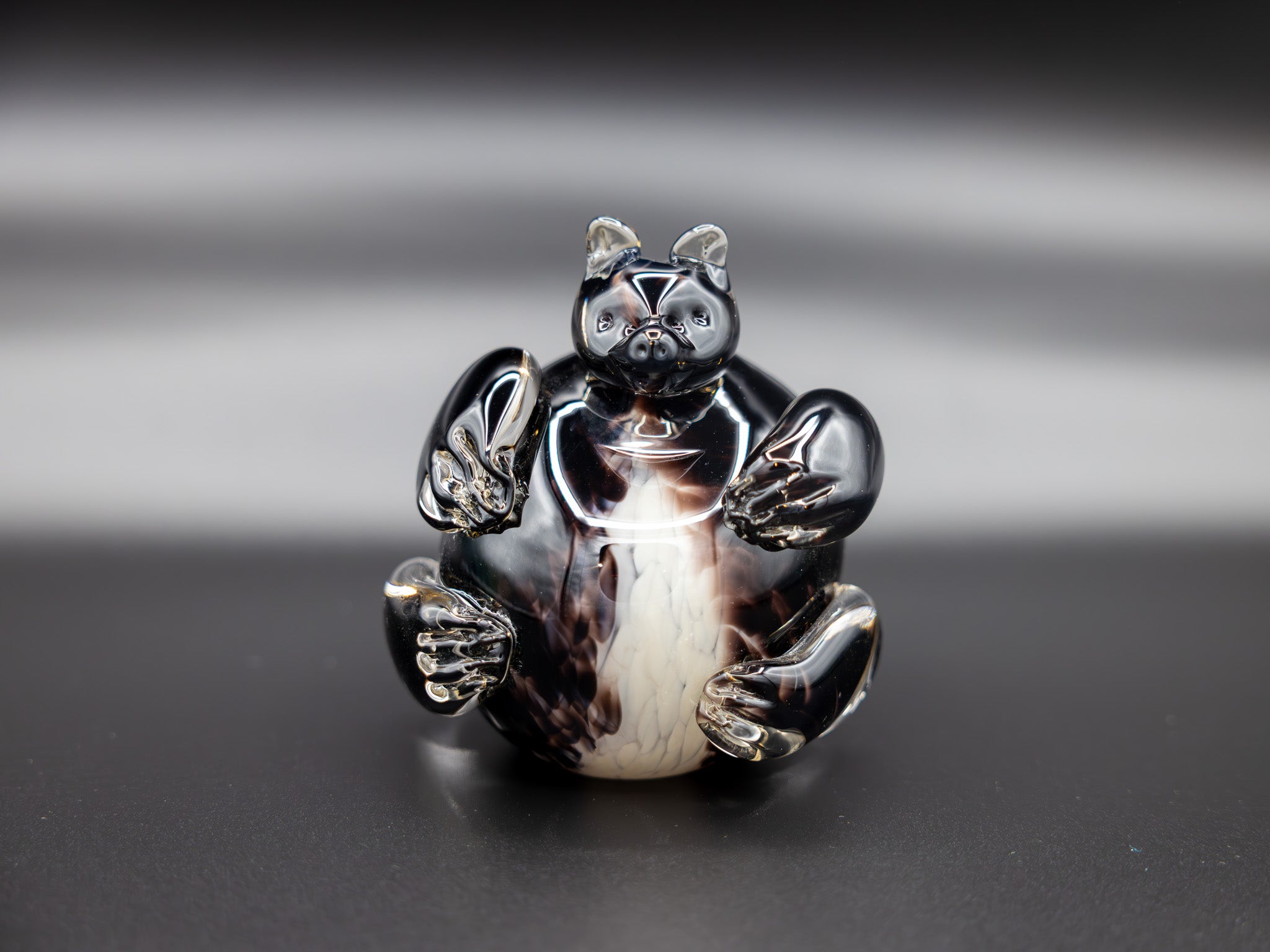 Glass figurine of a bear with a white background