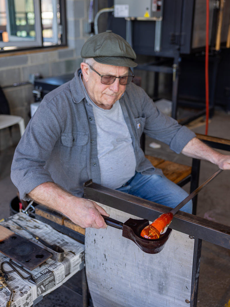 A guest making a paperweight