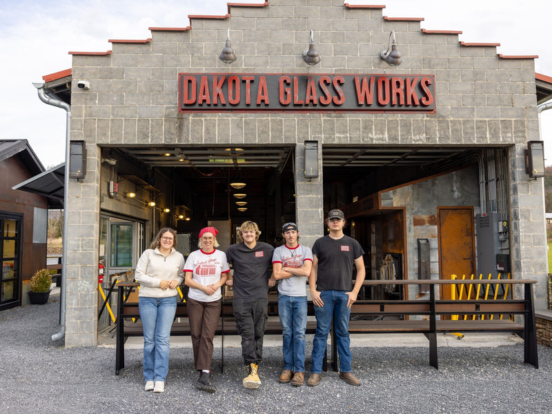 the Dakota Glass Works crew posing in front of the studio